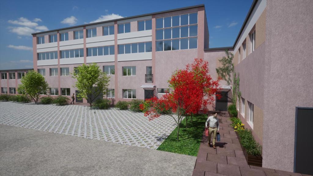 a man walking in front of a building at HOSTEL PARK-Dobraszczecińska in Szczecińska