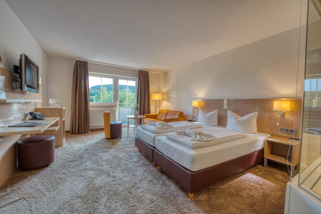 Postel nebo postele na pokoji v ubytování Hotel & SPA Reibener-Hof