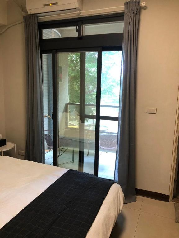 Postel nebo postele na pokoji v ubytování Yi Jia Homestay