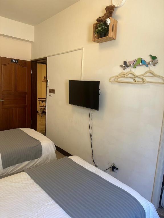 Postel nebo postele na pokoji v ubytování Yi Jia Homestay