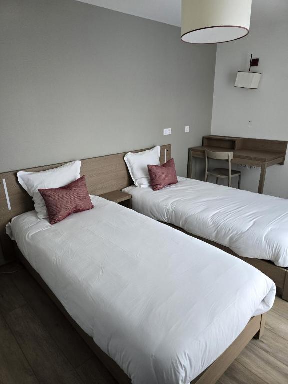 Postel nebo postele na pokoji v ubytování Terres de France - Appart'Hotel Quimper Bretagne