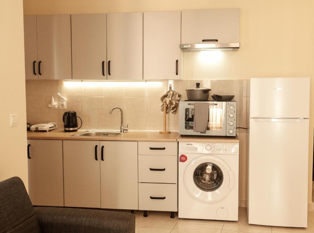 Kuchyň nebo kuchyňský kout v ubytování Maria's appartments