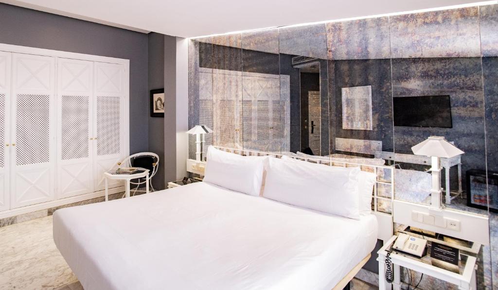 Posteľ alebo postele v izbe v ubytovaní AZZ Mérida Medea Hotel