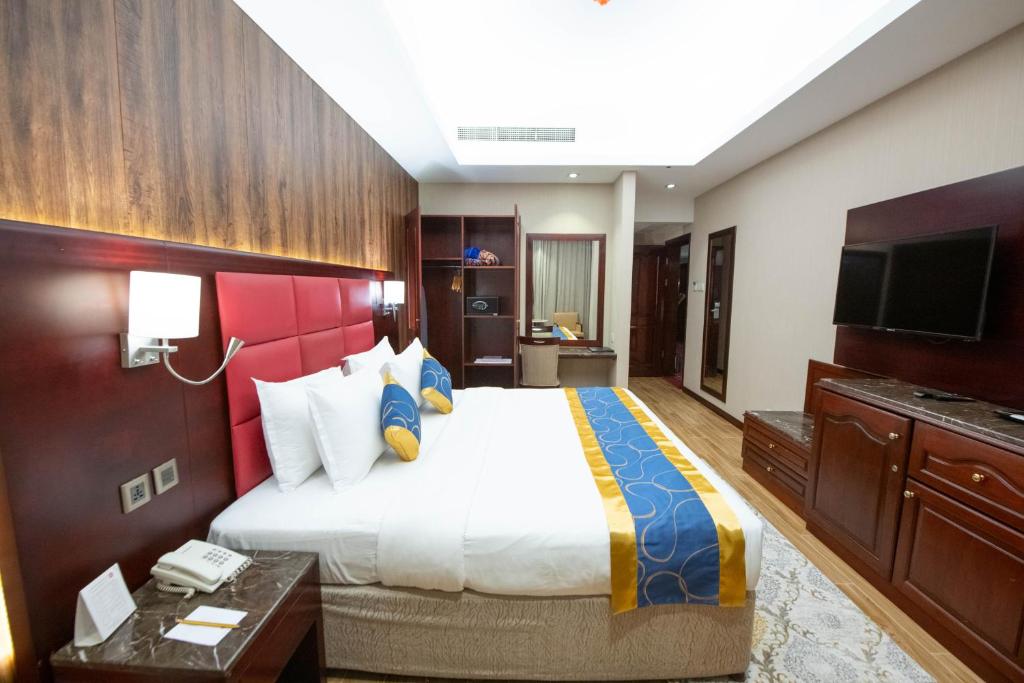 Postel nebo postele na pokoji v ubytování Ramee Guestline Hotel