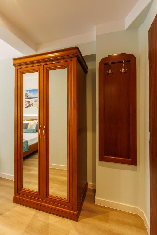 Postel nebo postele na pokoji v ubytování Hotel Amiral