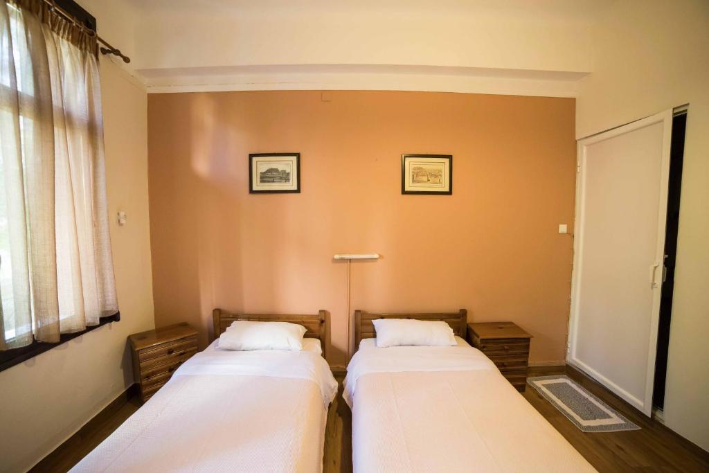 Posteľ alebo postele v izbe v ubytovaní Tempi Hotel