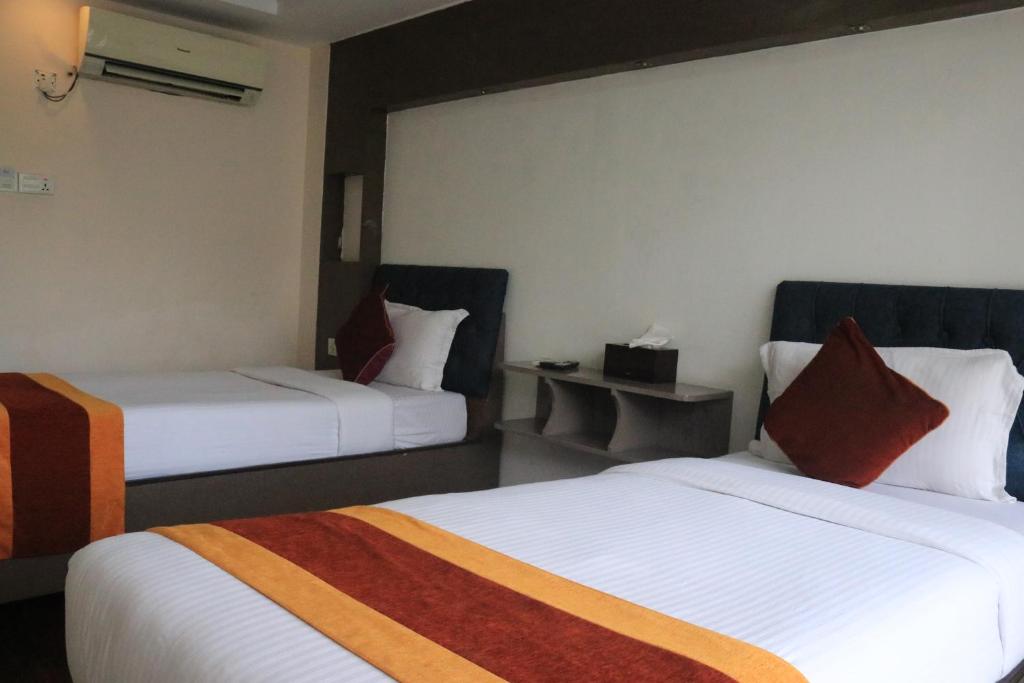 Postel nebo postele na pokoji v ubytování Hotel Kathmandu square