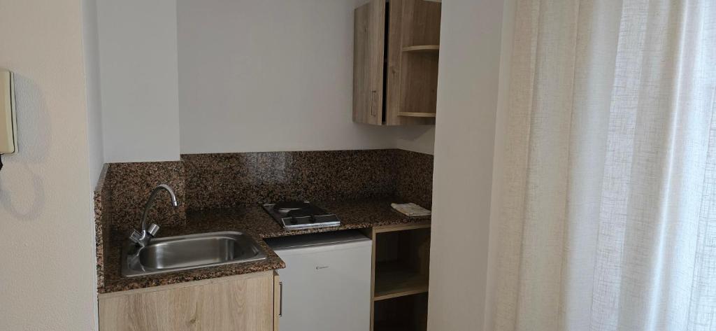 Kuchyň nebo kuchyňský kout v ubytování Hotel Rialta