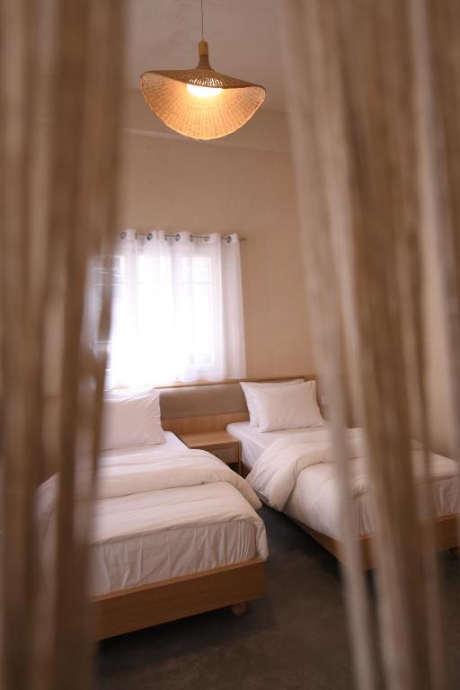Postel nebo postele na pokoji v ubytování Neoli