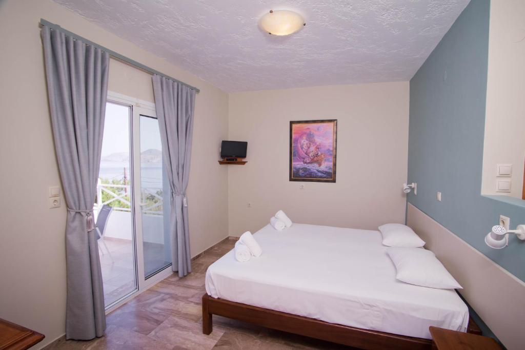 Postel nebo postele na pokoji v ubytování Acropolis Hotel