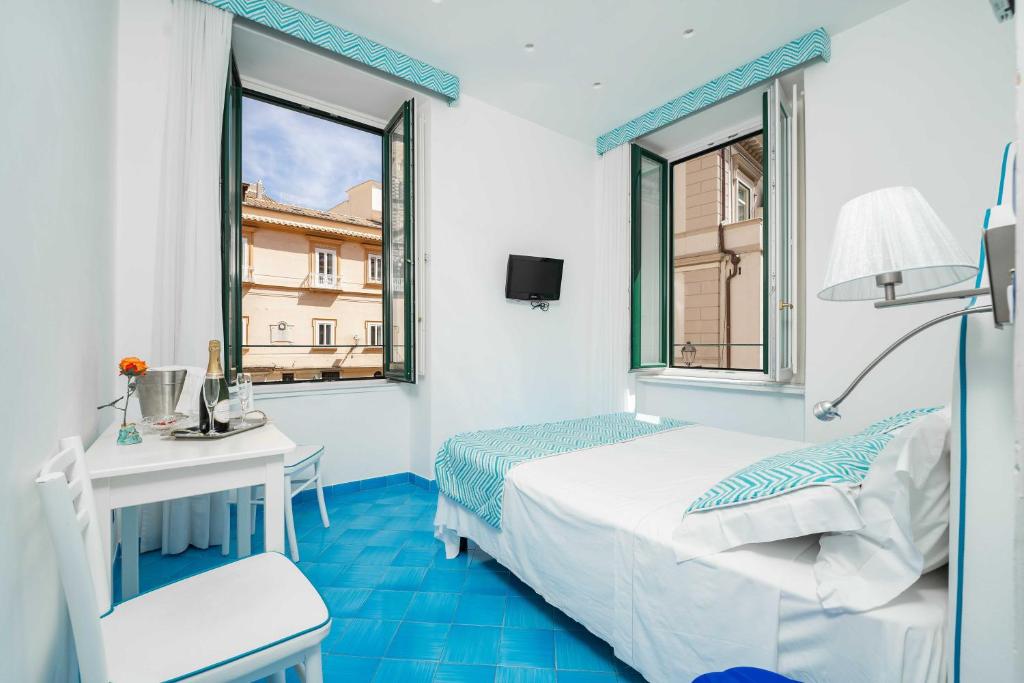 Postel nebo postele na pokoji v ubytování Albergo S. Andrea