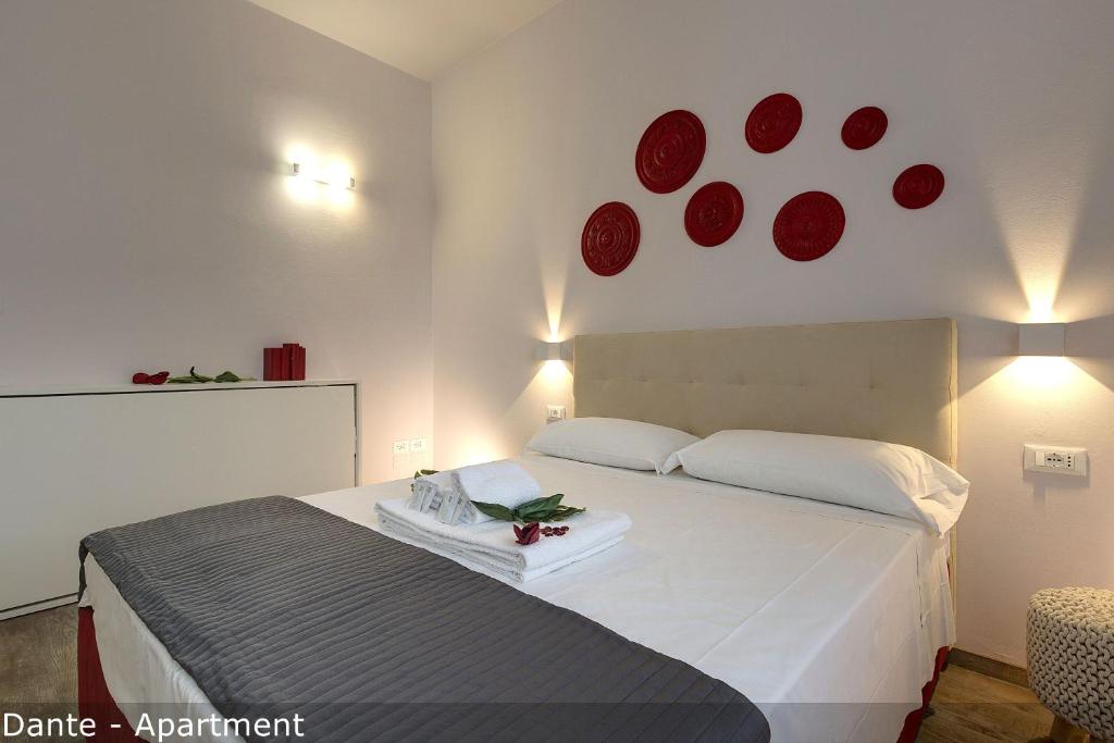 Posteľ alebo postele v izbe v ubytovaní Dante & Virgilio Apartments by Mamo Florence