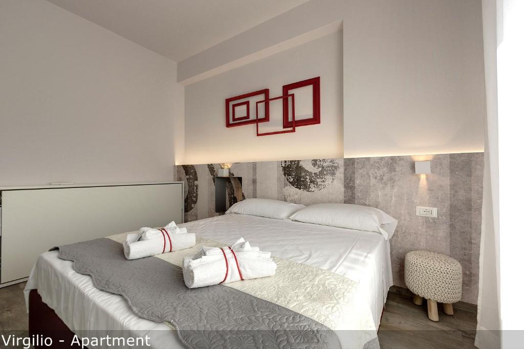 Posteľ alebo postele v izbe v ubytovaní Dante & Virgilio Apartments by Mamo Florence