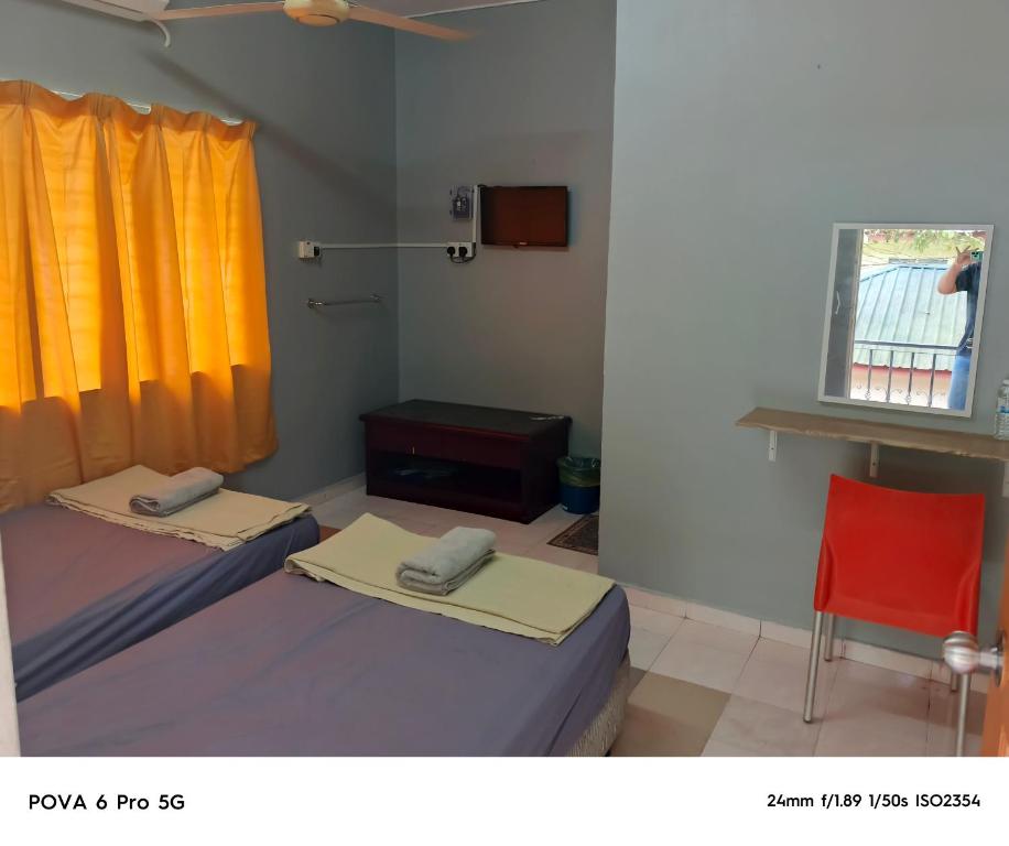 Postel nebo postele na pokoji v ubytování Resort Iman D'Semungkis