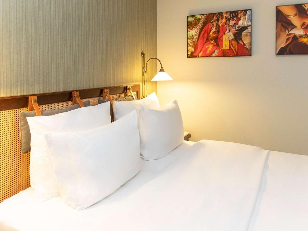 Postel nebo postele na pokoji v ubytování Mercure Hotel Frankfurt Airport Langen