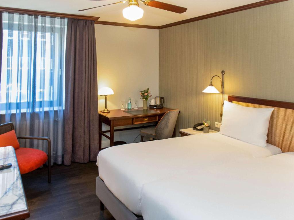 Postel nebo postele na pokoji v ubytování Mercure Hotel Frankfurt Airport Langen