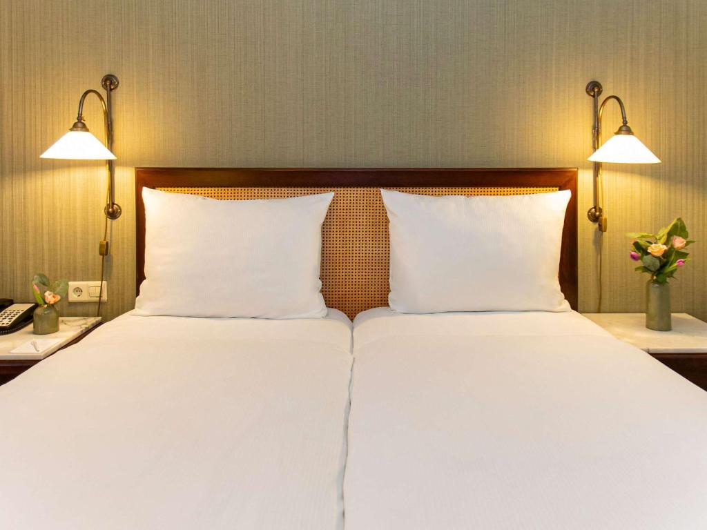 Postel nebo postele na pokoji v ubytování Mercure Hotel Frankfurt Airport Langen