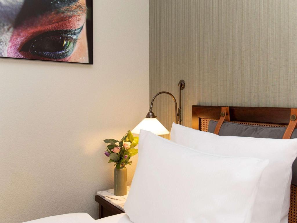 Postel nebo postele na pokoji v ubytování Mercure Hotel Frankfurt Airport Langen