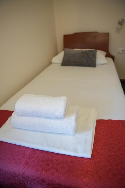 Postel nebo postele na pokoji v ubytování Comfort Lodge