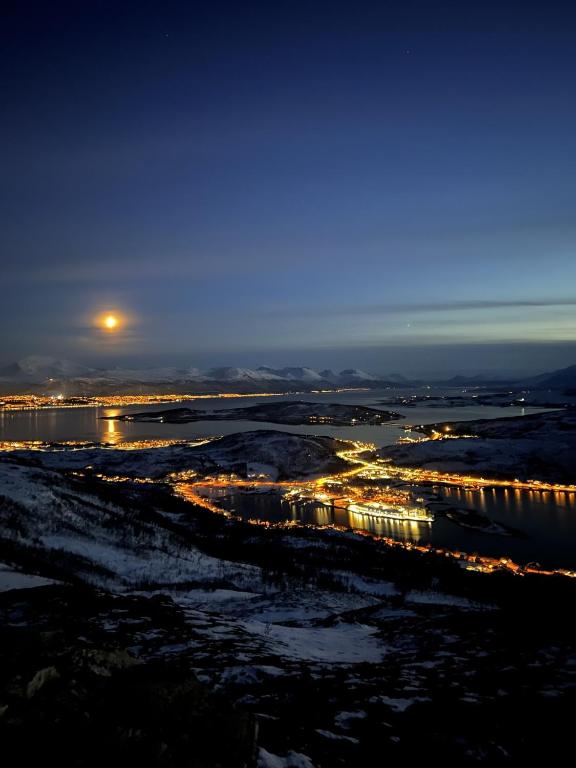an aerial view of a city at night at My Home Kaldfjorden in Tromsø
