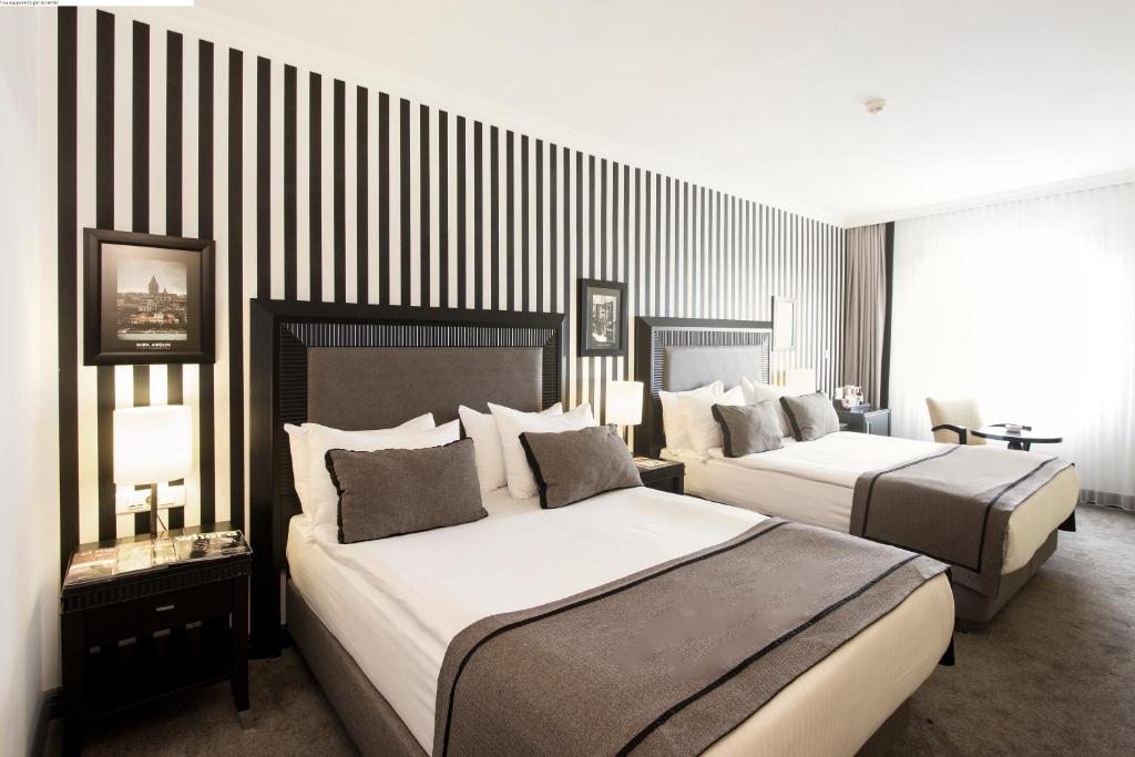 Postel nebo postele na pokoji v ubytování Avantgarde Hotel Taksim