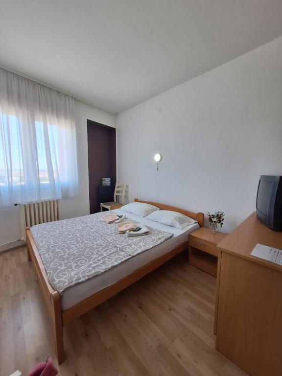 Postel nebo postele na pokoji v ubytování Hotel Konaciste Trstenik