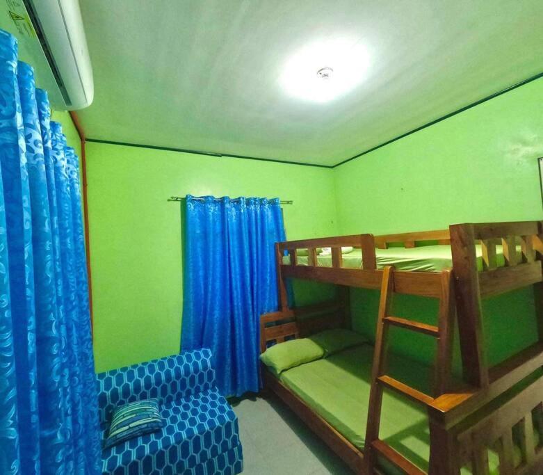 Postel nebo postele na pokoji v ubytování SecondHome La Union