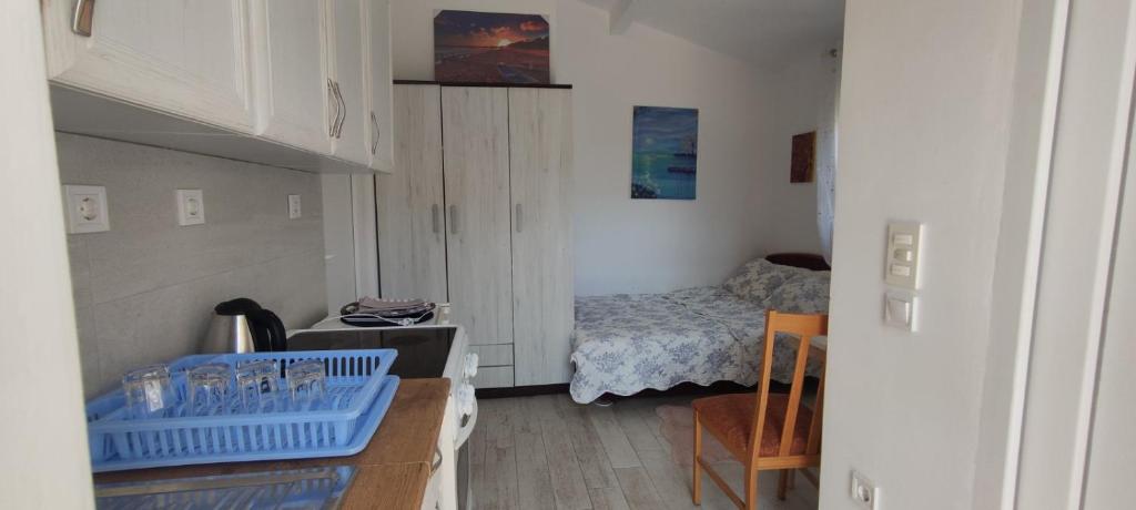 Postel nebo postele na pokoji v ubytování Tijana Apartments