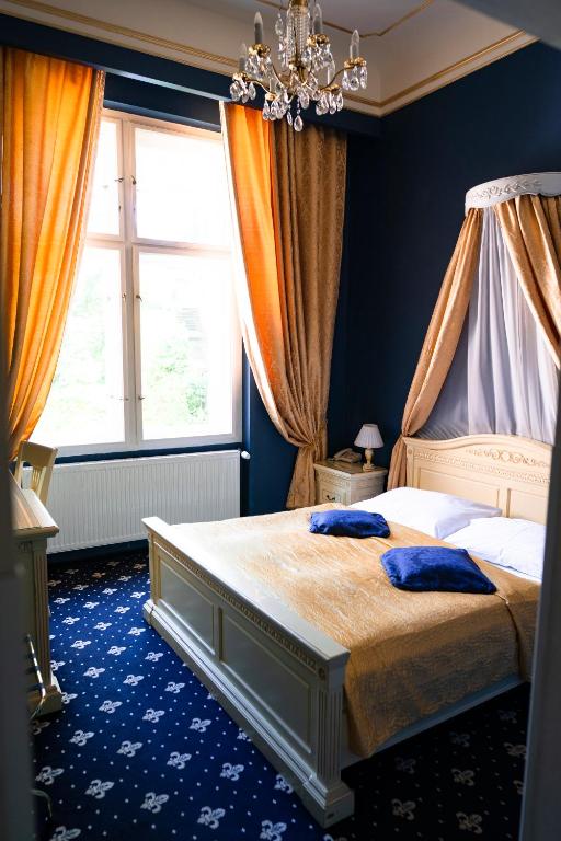 Postel nebo postele na pokoji v ubytování Alisa Hotel