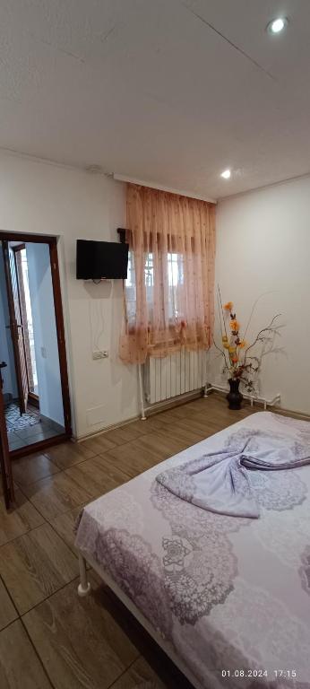 Postel nebo postele na pokoji v ubytování Casa MILLY Constanta