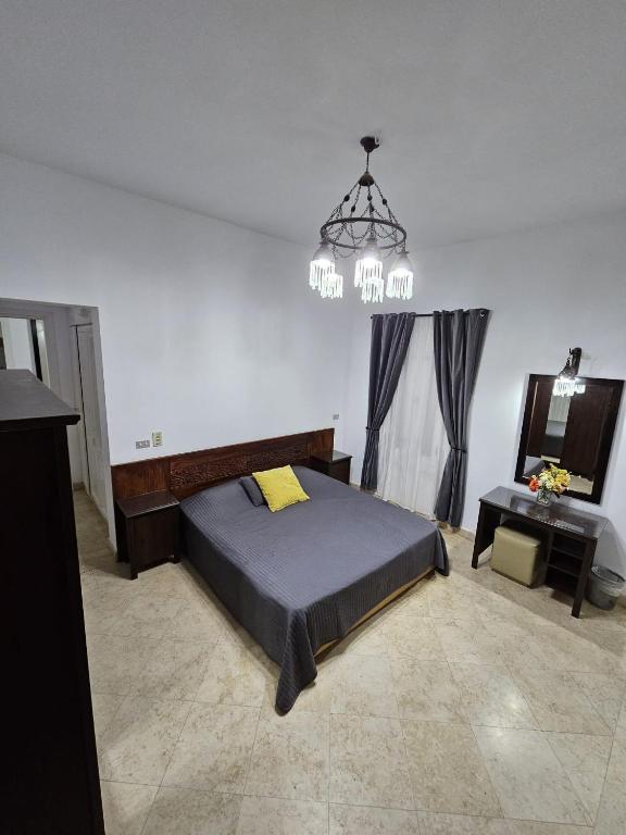 A bed or beds in a room at Extremely Private Villa with Optional Pool Heating