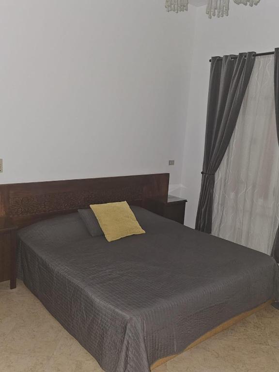 A bed or beds in a room at Extremely Private Villa with Optional Pool Heating