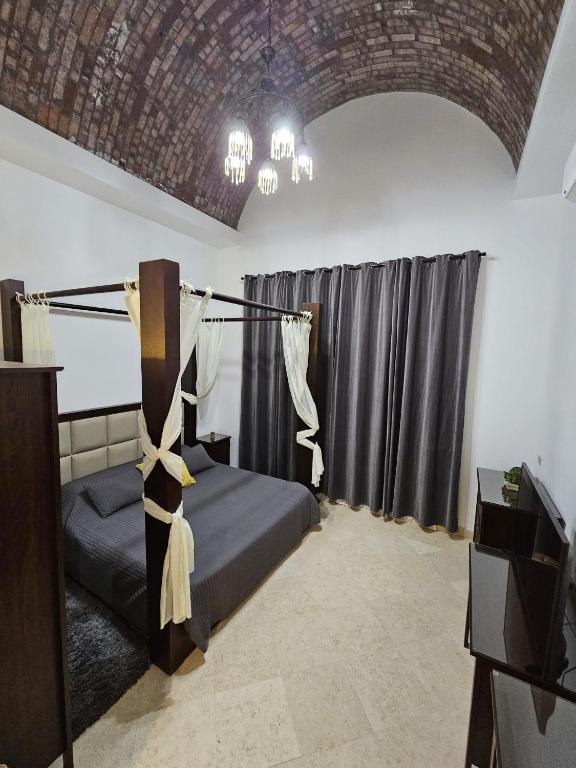 A bed or beds in a room at Extremely Private Villa with Optional Pool Heating