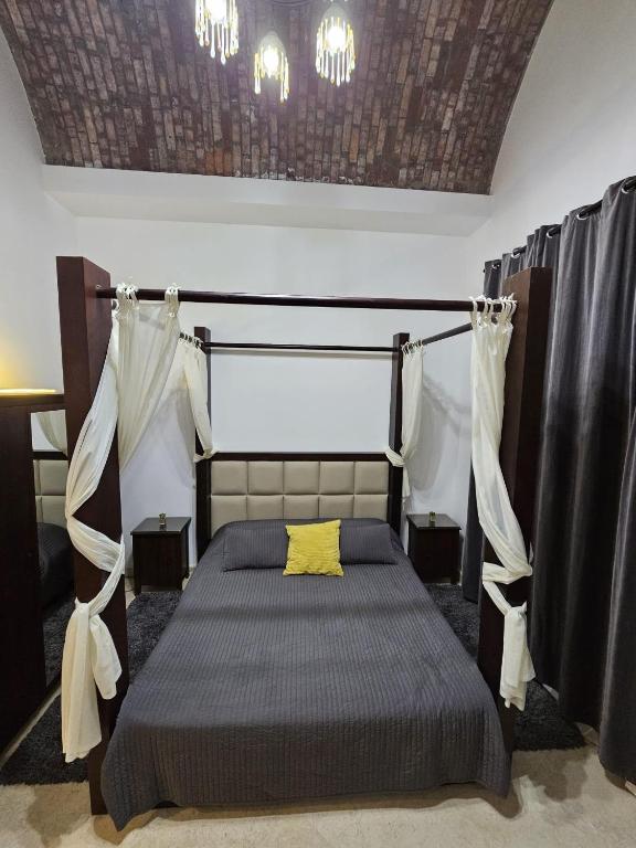A bed or beds in a room at Extremely Private Villa with Optional Pool Heating