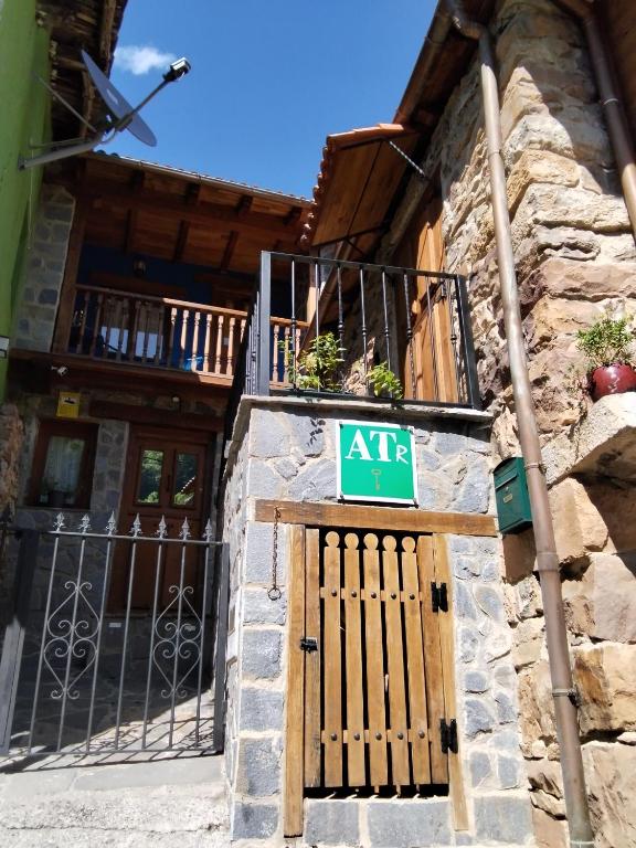 an exit sign on the side of a building at Casa Marcelo in Proaza