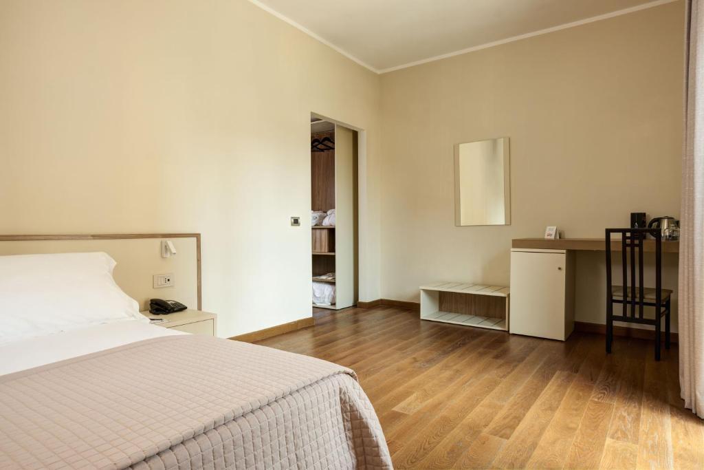 Postel nebo postele na pokoji v ubytování Antum Hotel
