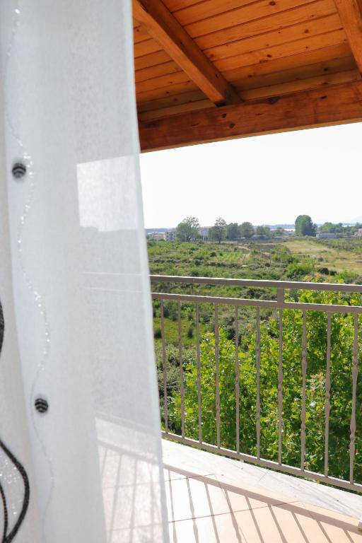 a balcony with a view of a vineyard at Villa Apet 23 in Shkodër