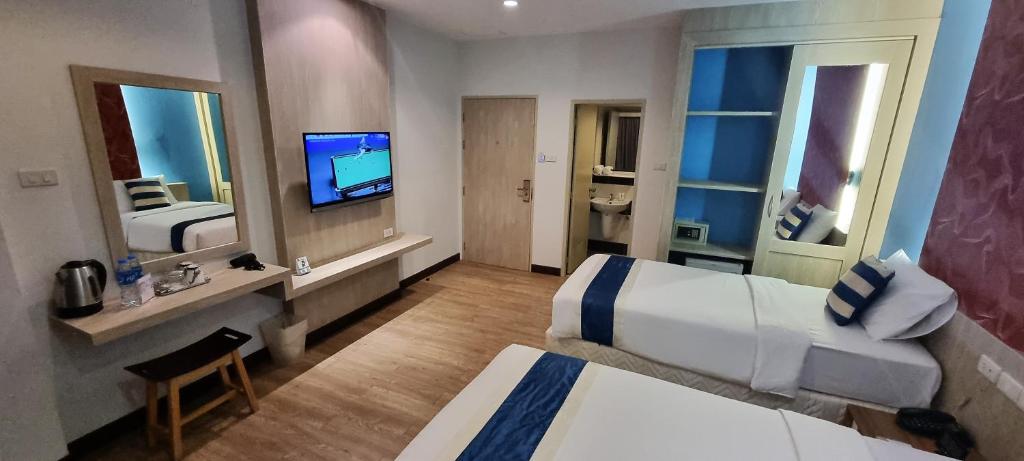 Postel nebo postele na pokoji v ubytování iCheck inn Chill Patong