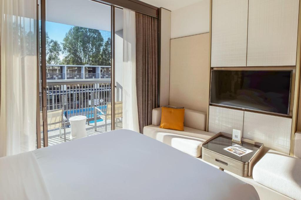 Postel nebo postele na pokoji v ubytování Sheraton Universal