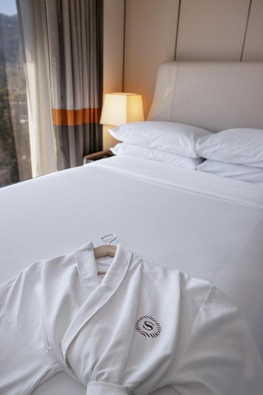 Postel nebo postele na pokoji v ubytování Sheraton Universal
