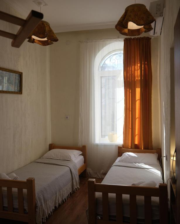 Postel nebo postele na pokoji v ubytování Hotel 1870