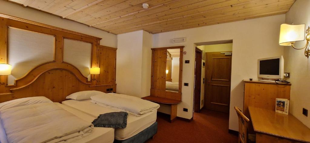 Postel nebo postele na pokoji v ubytování Hotel Roy