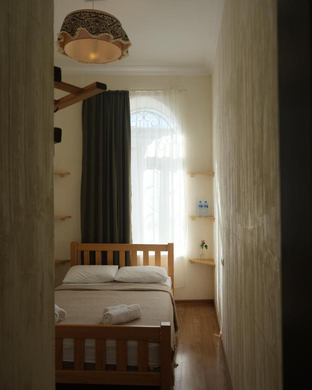 Postel nebo postele na pokoji v ubytování Hotel 1870