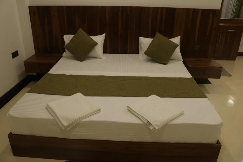 Postel nebo postele na pokoji v ubytování New Sandra Guesthouse