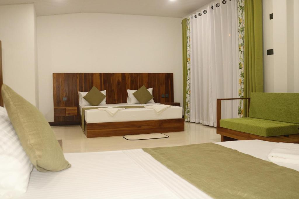 Postel nebo postele na pokoji v ubytování New Sandra Guesthouse