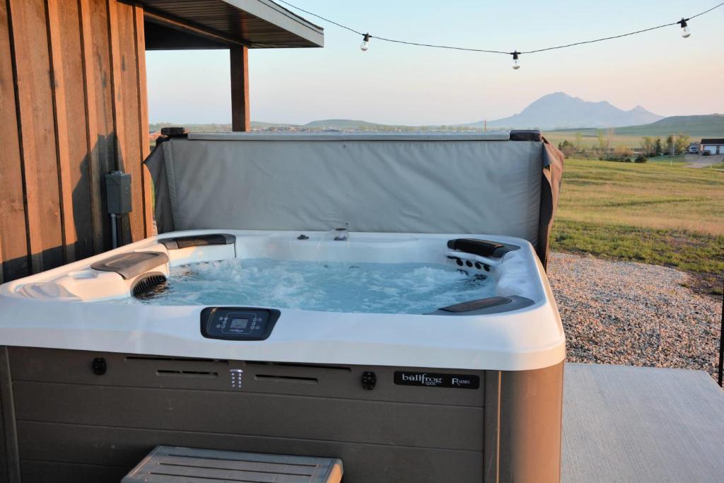 a hot tub sitting on the side of a house at Hot Tub & Panoramic Views Bear Butte &Buffalo Chip in Sturgis