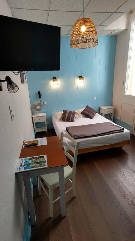 Postel nebo postele na pokoji v ubytování Hotel Le Colibri