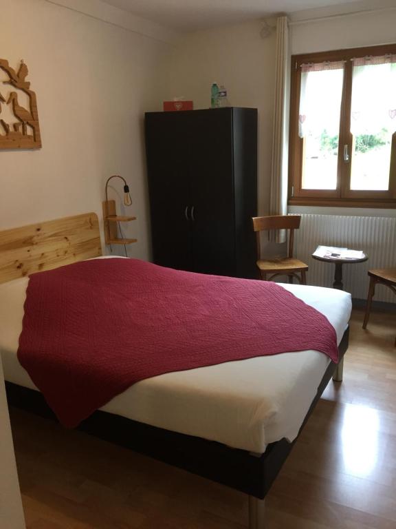 Postel nebo postele na pokoji v ubytování Chambres d'hôtes A la Fecht Nature et Bien-être