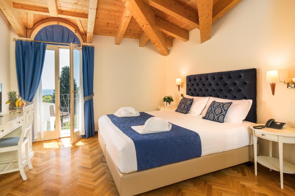 Postel nebo postele na pokoji v ubytování Hotel Galeazzi