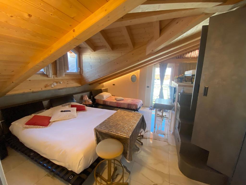 Postel nebo postele na pokoji v ubytování Villa Claudia